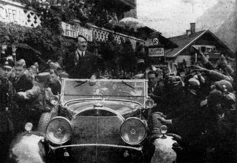 Adolf Hitler is greeted by the crowd in Oberammergau